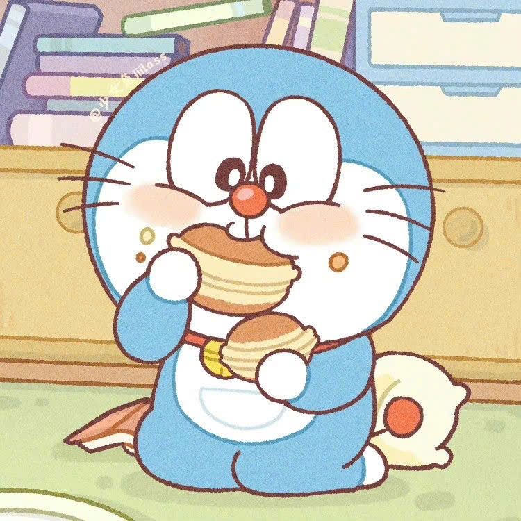 Ảnh doraemon ăn bánh cute Ảnh doraemon ăn bánh cute